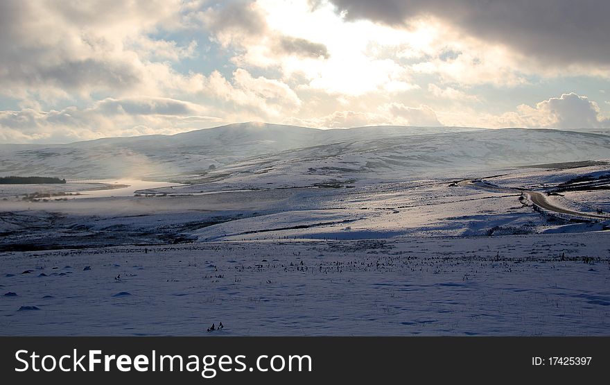 Denbigh Moors thick with snow on a cloudy bright day. Denbigh, Denbighshire, Wales. Denbigh Moors thick with snow on a cloudy bright day. Denbigh, Denbighshire, Wales.