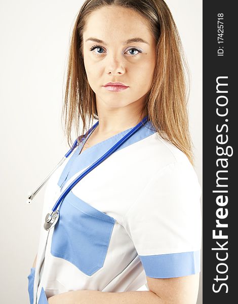 Young woman doctor or nurse wearing scrubs