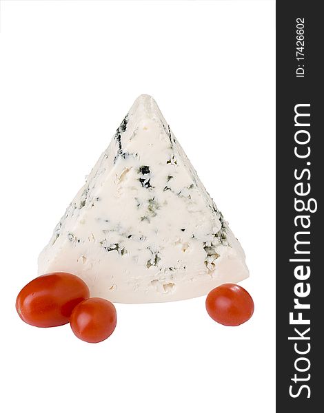 Slice of the Danish blue cheese with a mould on a white background with tomato. Slice of the Danish blue cheese with a mould on a white background with tomato.
