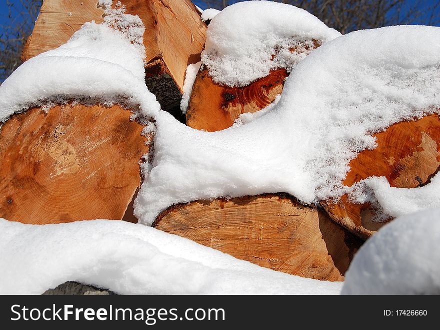 Stack of fire wood covered in snow