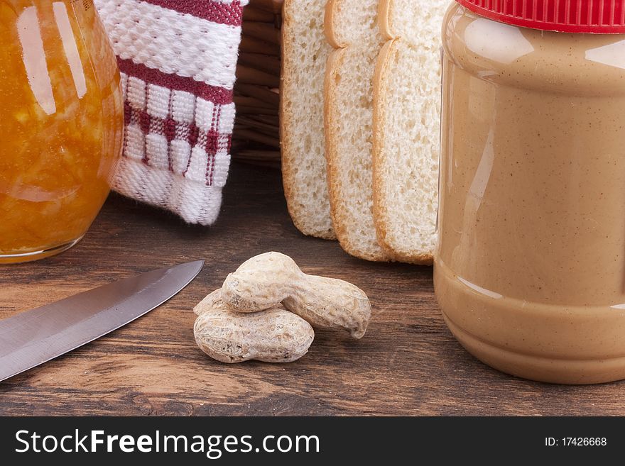 The plastic container with Peanut butter for sweet sandwiches.