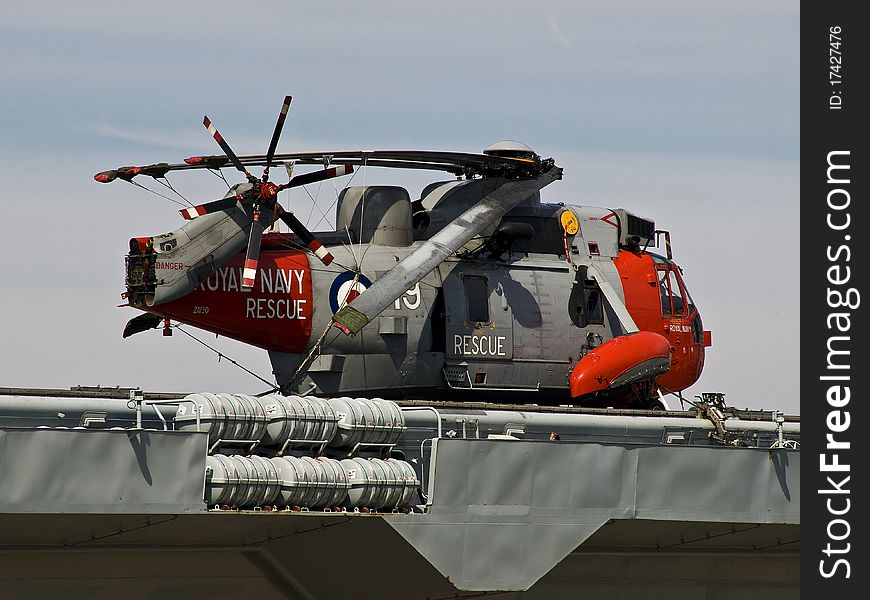 A shiny Royal Navy helicopter at rest on the Ark Royal at Liverpool. A shiny Royal Navy helicopter at rest on the Ark Royal at Liverpool