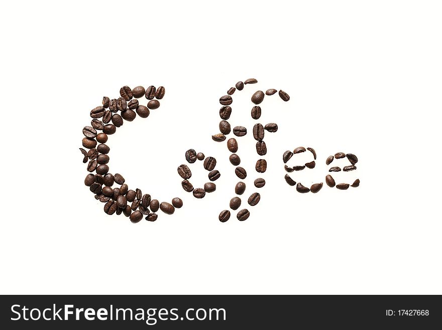 The word coffee written by brown coffe beans. The word coffee written by brown coffe beans