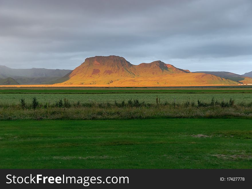 Sunset on the hills behind Vik. Sunset on the hills behind Vik