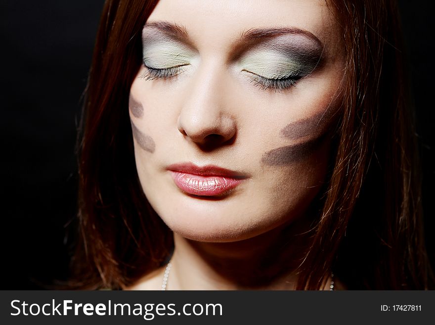 Attractive and girl have military makeup in studio. Attractive and girl have military makeup in studio