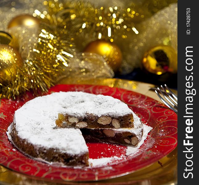 Gingerbread onred flat with golden Christmas decorations