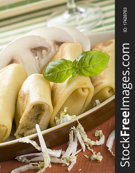 Four croquettes in brown dish. Four croquettes in brown dish