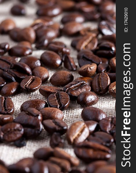 Coffee beans on rough fabric, side light