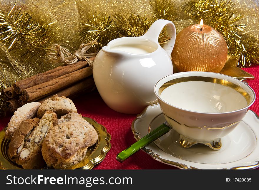 Milk and cookies with Christmas decorations on red background. Milk and cookies with Christmas decorations on red background