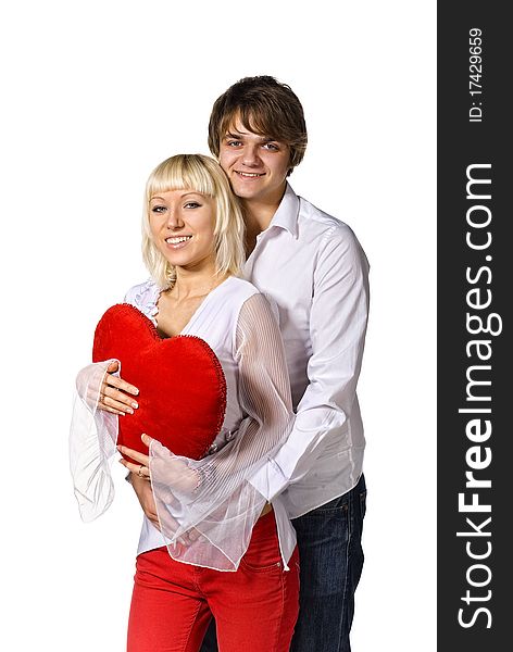 Young happy couple with red heart. isolated on white. Young happy couple with red heart. isolated on white