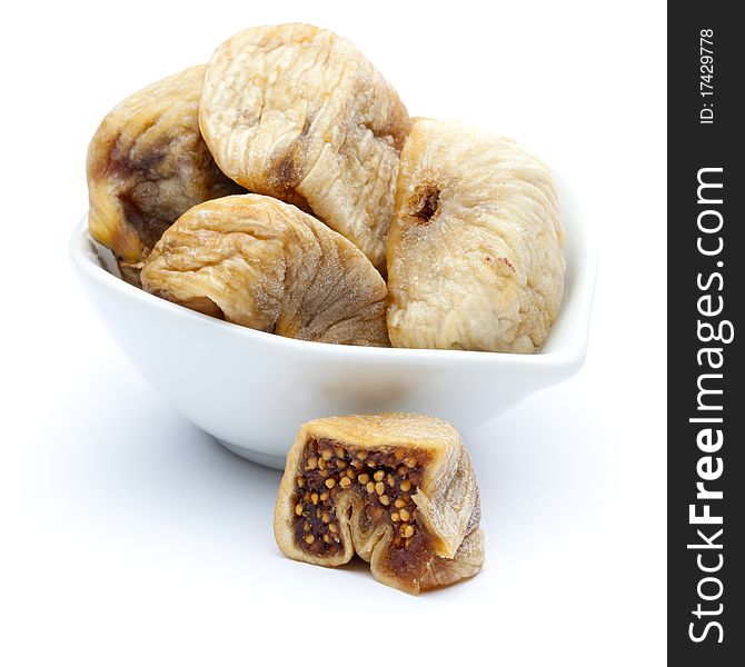 Fresh dried figs isolated on white background in a bowl