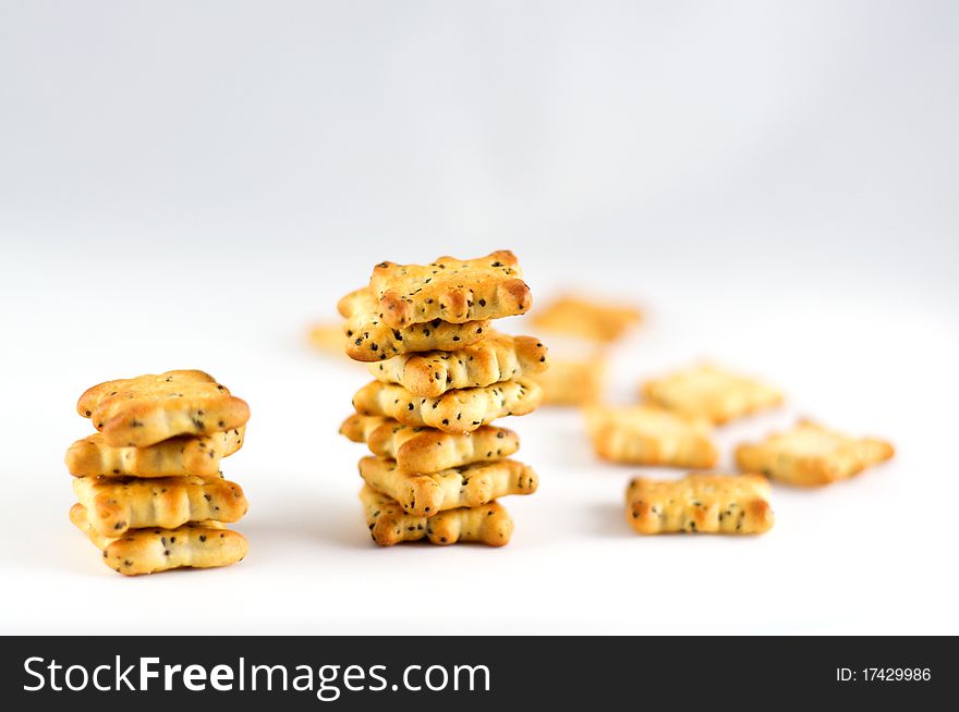 Crackers savory pastry with poppy seeds on a white background