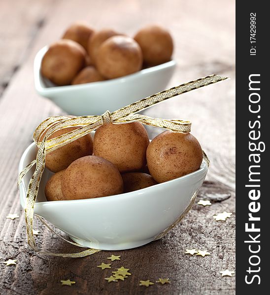 Marzipan balls in a bowl with ribbon. Marzipan balls in a bowl with ribbon