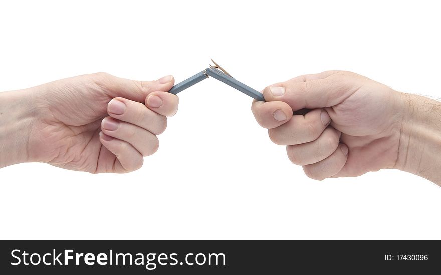 Female and male hands breaking wooden pencil. Female and male hands breaking wooden pencil