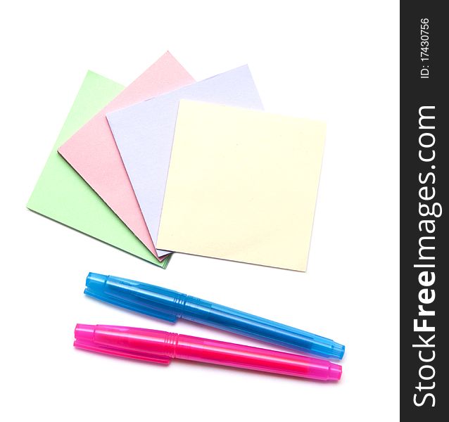 Stack of color notes and markers iisolated on white background