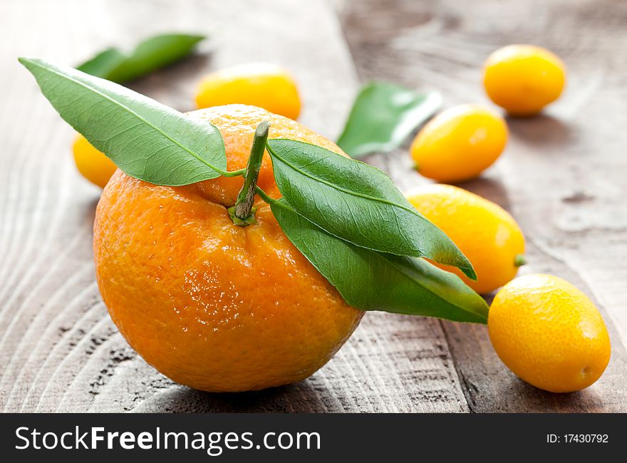 Tangerine and kumquats on table