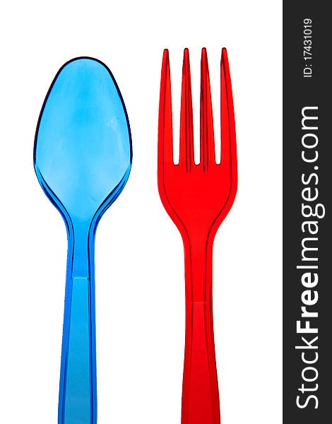 Dark blue plastic spoon and red plastic plug. Dark blue plastic spoon and red plastic plug