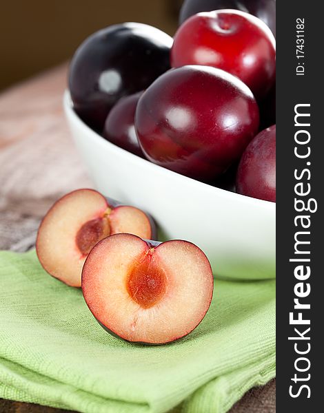 Red plums in a bowl