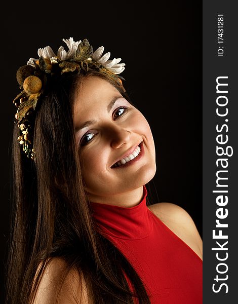 Portrait of young pretty woman with wreath