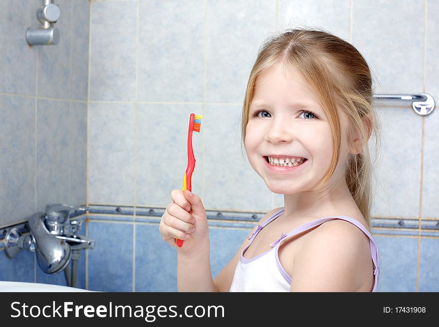 Little girl with toothbrush