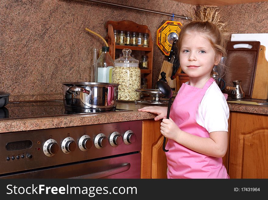 Girl Cooking In The Kitchen