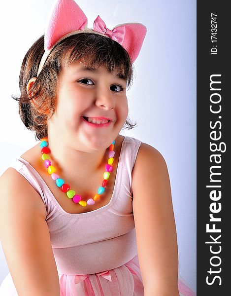 Girl with pink tutu on a white background