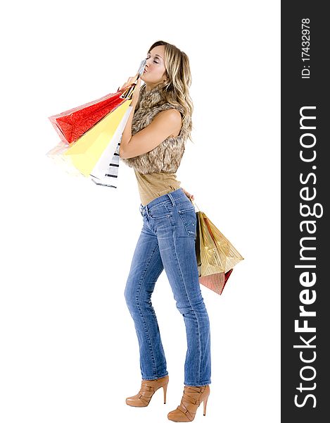 blond woman with shopping bags smiling happily. blond woman with shopping bags smiling happily