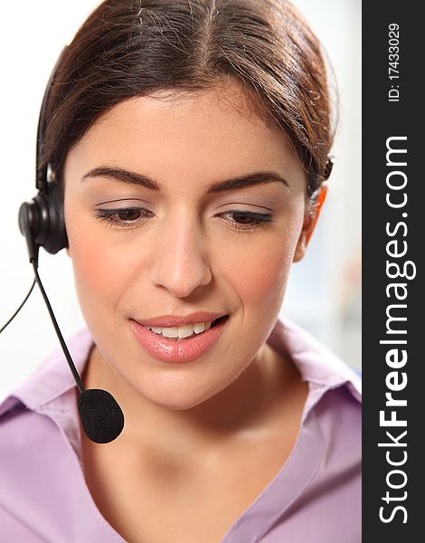 Beautiful young female secretary wearing headset