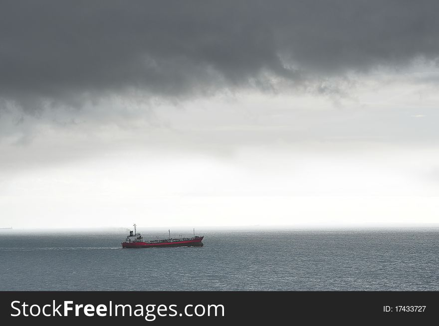 Single Ship braving stormy weather. Single Ship braving stormy weather