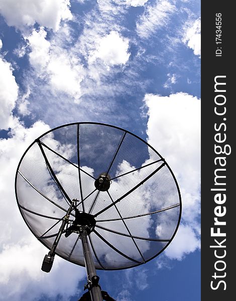 Satellite dish with sky background