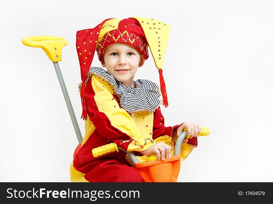 The boy in a parsley suit, on a bicycle, a white background