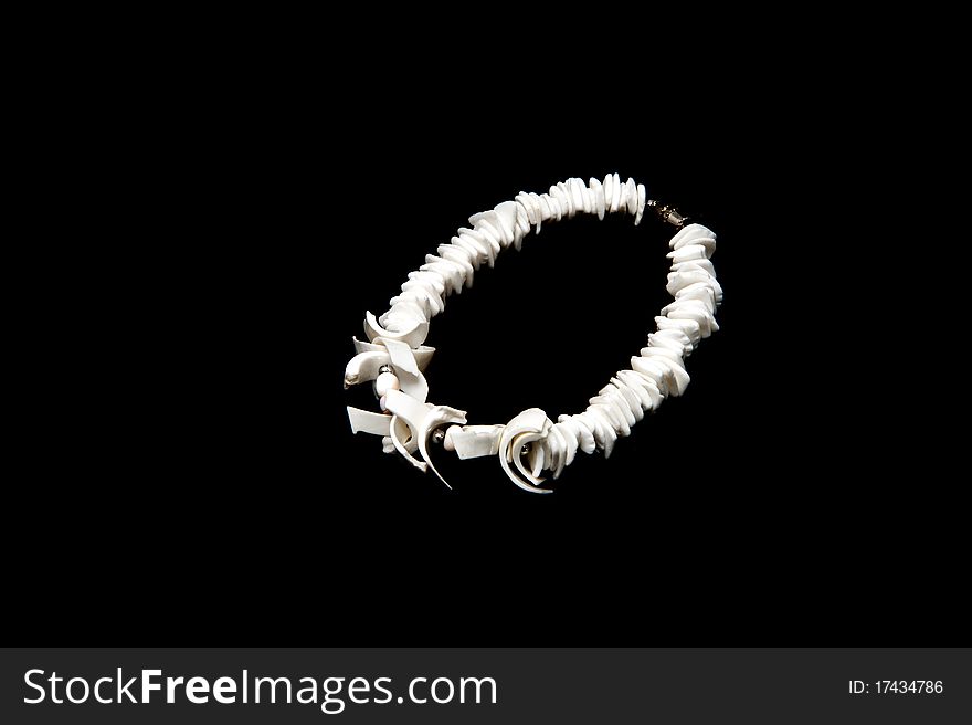 Sea shell bangle isolated on black