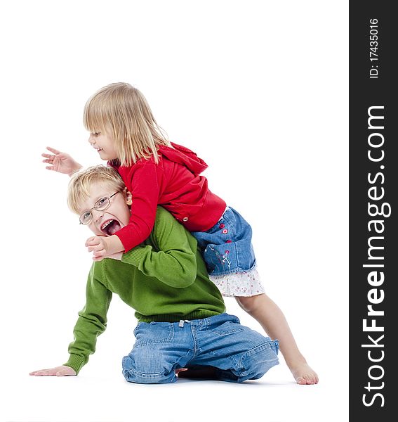 Two young siblings fooling around with each other - isolated on white. Two young siblings fooling around with each other - isolated on white