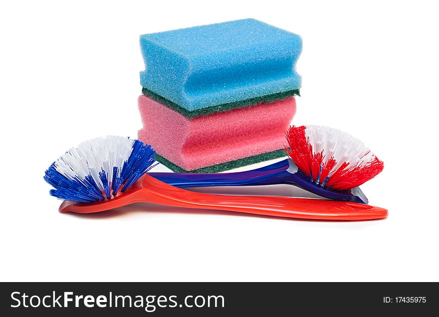 Cleaning brushes and kitchen sponges isolated on a white background. Cleaning brushes and kitchen sponges isolated on a white background.