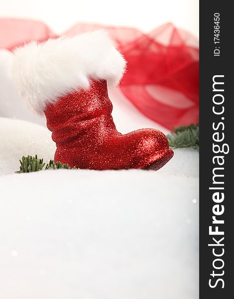 A Christmas boot in a winter landscape with copyspace. A Christmas boot in a winter landscape with copyspace