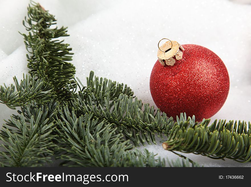 One Christmas bauble in a winter scene. One Christmas bauble in a winter scene