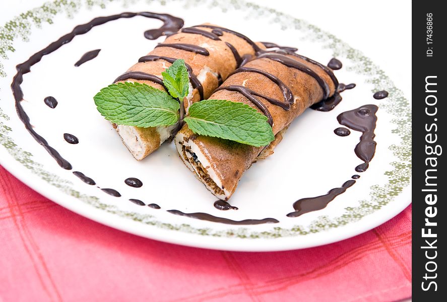 Pancakes with cottage cheese poured chocolate