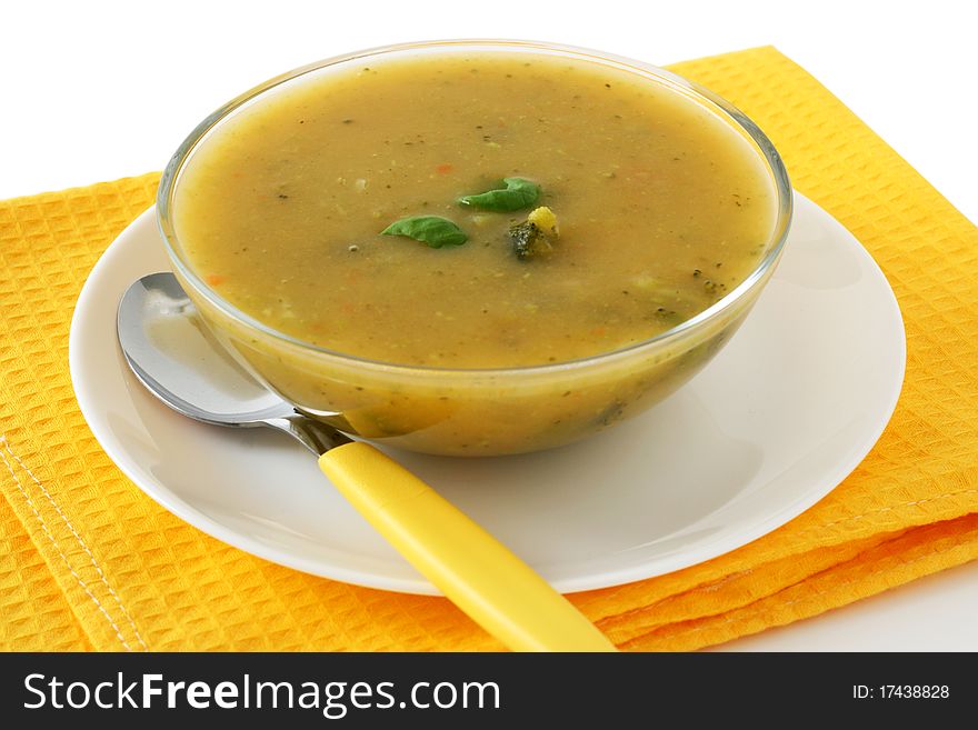Vegetable soup with basil in a bowl