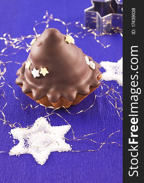 Christmas chocolate glazed muffin with stars. Christmas chocolate glazed muffin with stars