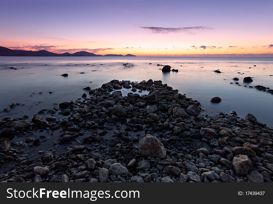 Colorful sunrise on the rocky coast