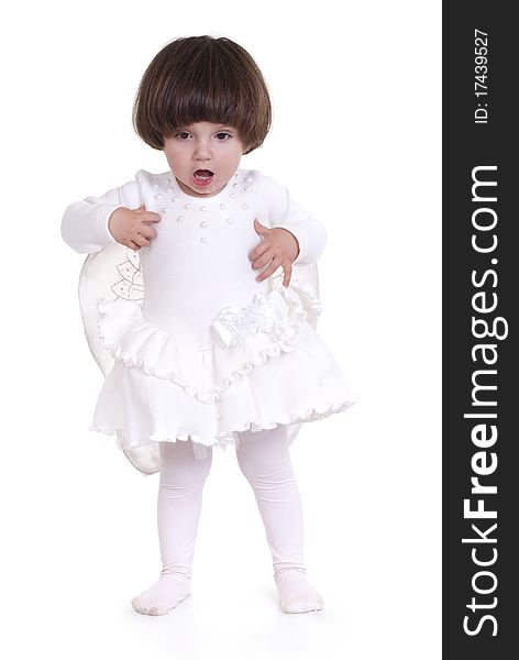 Portrait of a little girl dressed as an angel with white dress