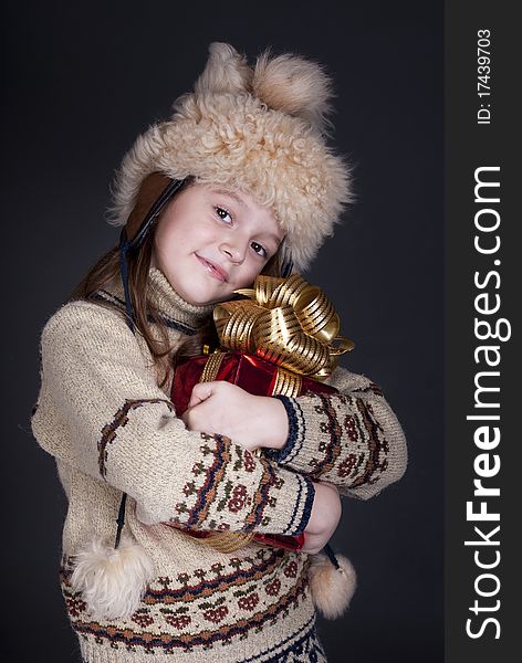 Happy little girl with Christmas present