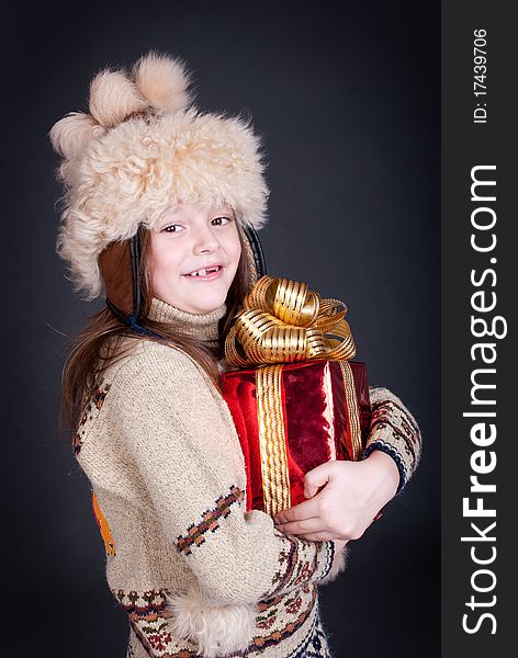 Happy little girl with Christmas present