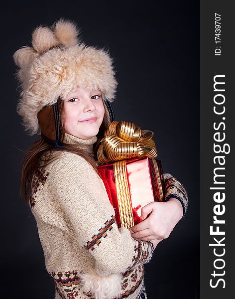 Happy little girl with Christmas present