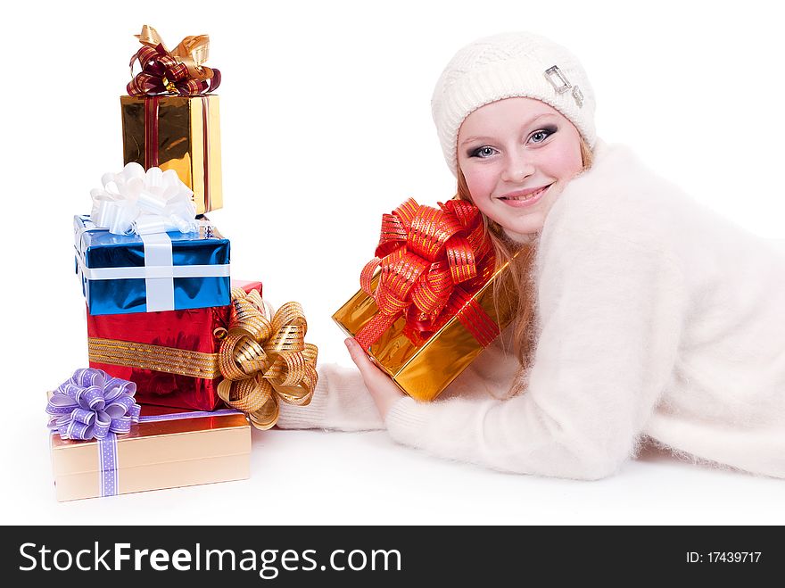 Beautiful girl with stack gift box. Isolated.