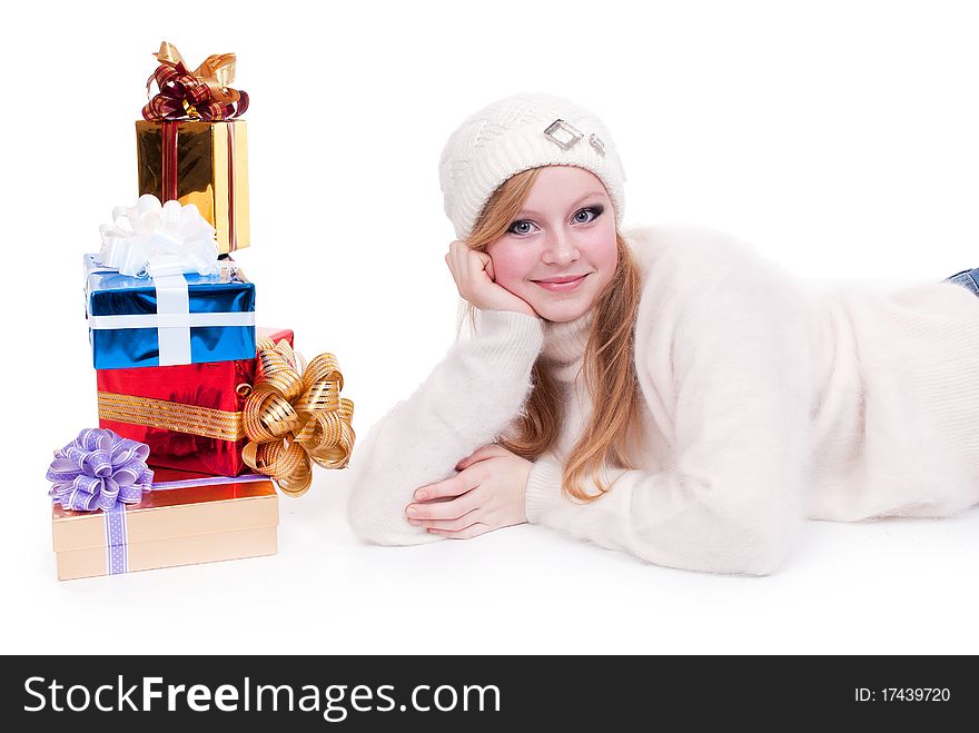 Beautiful girl with stack gift box. Isolated.