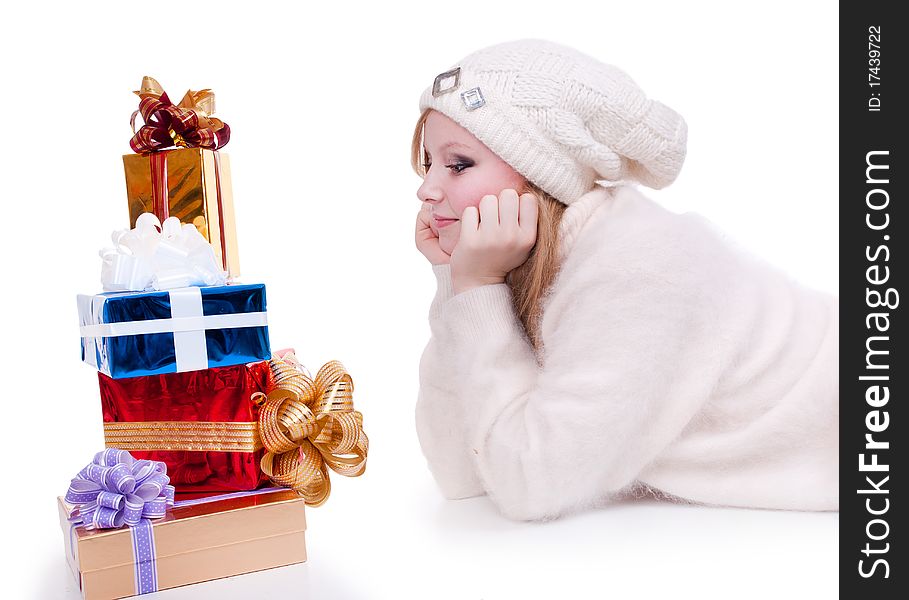 Beautiful girl with stack gift box. Isolated.