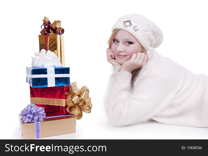 Beautiful girl with stack gift box. Isolated.