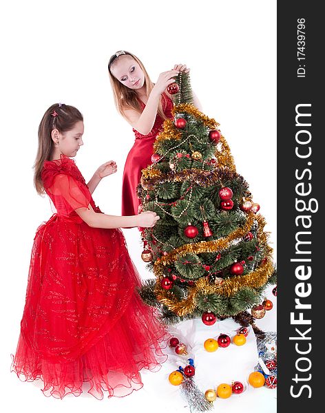 Two Beautiful girl decorating a Christmas tree. Two Beautiful girl decorating a Christmas tree