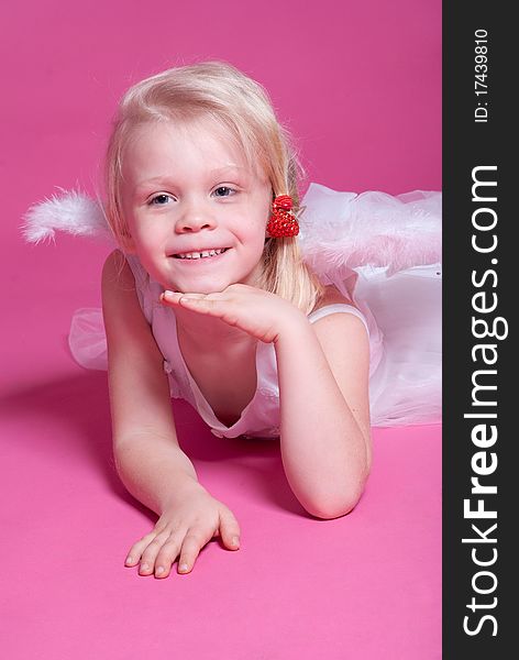 Little girl on pink studio background. Little girl on pink studio background
